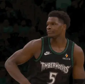 A Man In A Timberwolves Jersey With The Number 5 On His Chest
