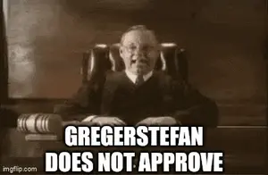 A Judge Is Sitting At A Desk With A Book In Front Of Him And The Words Gregerstefan Does Not Approve .
