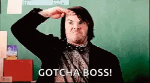 A Man In A Suit And Bow Tie Is Saluting In Front Of A Blackboard And Says Gotcha Boss !