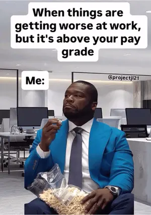 A Man In A Suit And Tie Eating Popcorn With A Caption Saying When Things Are Getting Worse At Work