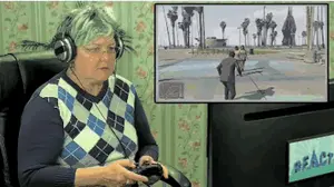 A Woman Wearing Headphones Is Playing A Video Game On A Monitor That Says React