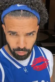 A Man With A Beard Wearing A Blue Nike Headband And A Kentucky Jersey