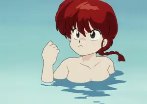 A Girl With Red Hair Is Swimming In A Pool