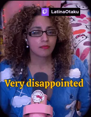 A Woman With Curly Hair Is Wearing Glasses And A Hello Kitty Sweater