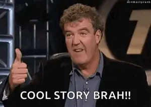 A Man In A Suit Is Giving A Thumbs Up .