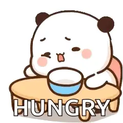 A Panda Bear Is Sitting At A Table With A Bowl Of Food And The Words `` Hungry '' .