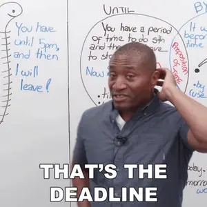 A Man Is Standing In Front Of A White Board With The Words That 'S The Deadline Written On It