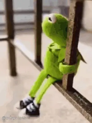Kermit The Frog Is Sitting On A Railing Wearing Sneakers