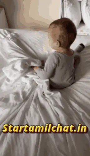A Baby Is Laying On A Bed With The Website Starttamilchat.In Displayed