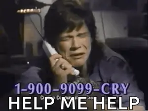 A Man Is Crying While Talking On A Telephone And Asking For Help .