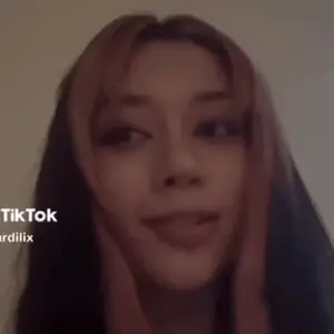 A Close Up Of A Woman 'S Face With The Words Tiktok Ardilix On The Bottom
