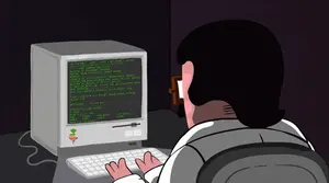 A Man Is Typing On A Keyboard In Front Of A Computer Monitor That Says ' Kernel ' On The Screen