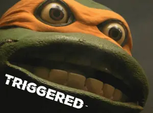A Close Up Of A Teenage Mutant Ninja Turtle 'S Face With The Word Triggered On The Bottom