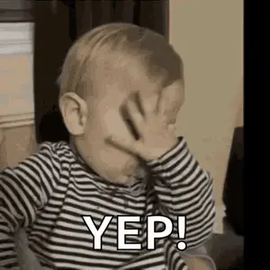 A Baby Is Covering His Face With His Hand And Saying Yes .