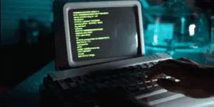 A Person Is Typing On A Keyboard With A Screen That Says Command