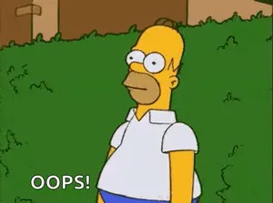 Homer Simpson From The Simpsons Is Standing In A Grassy Field .