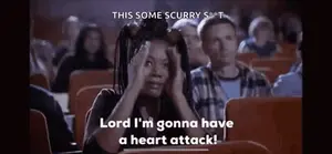 A Woman Is Sitting In A Theater Watching A Movie And Saying `` Lord I 'M Gonna Have A Heart Attack ''
