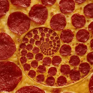 A Close Up Of A Pepperoni Pizza With A Spiral Design