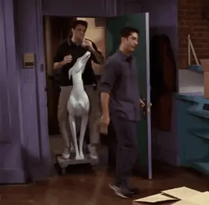 A Man Is Riding A Statue Of A Dog In A Room
