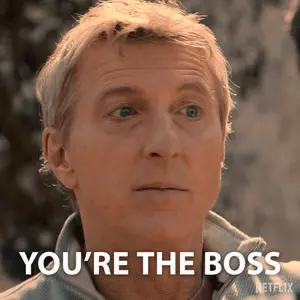 A Close Up Of A Man 'S Face With The Words " You 'Re The Boss "