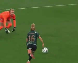 A Soccer Player Wearing The Number 16 Is Kicking A Ball