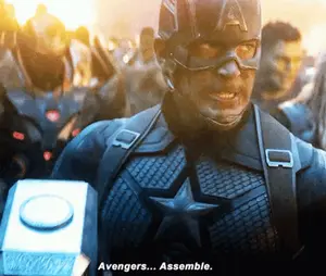 Captain America Is Holding A Hammer And Says Avengers Assemble